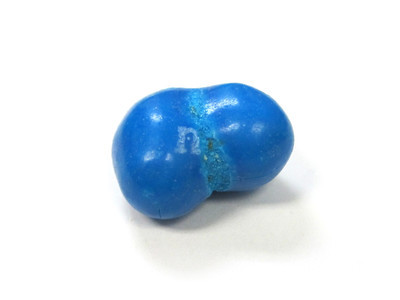 Blue double nut, with a grainy seam, the "m" half-obscured.