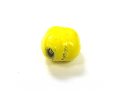 A yellow blob, with a dark scuff grainy irregularity.