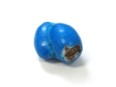 Two fused blue oblongs, with a chunk taken out of the nearest, facing you.