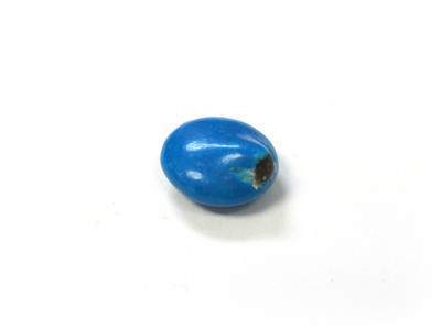 A plain blue, with a smooth raising nub, to the right. Exposed chocolate at the rightmost drop-off.