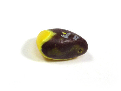 A deformed yellow one, but with almost no shell. However, the "m" is on the chocolate. There is also a ghostly pale yellow swirl along the side closest to us.