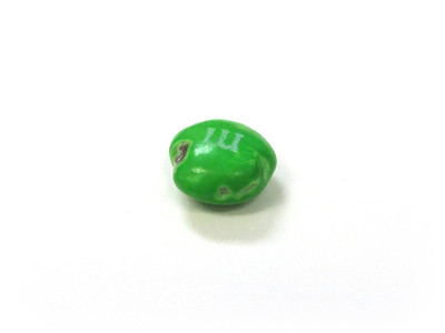 A scrappy small green one, with pockmarks on the right and a chunk missing on the left.