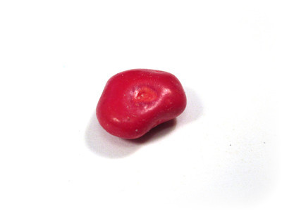 An irregularly-shaped small red one, with an indent in the middle.