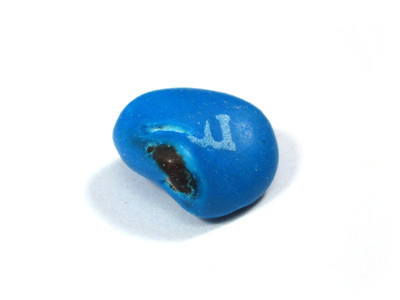 A messy blue one, with a squished-in side that has an exposed chocolatey nub.